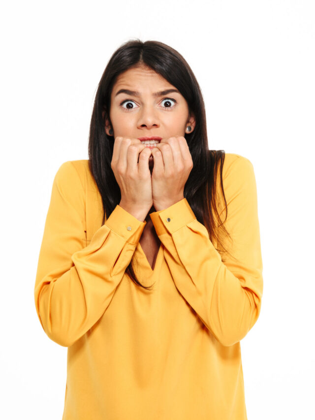 shocked-scared-young-lady-yellow-shirt-standing-isolated